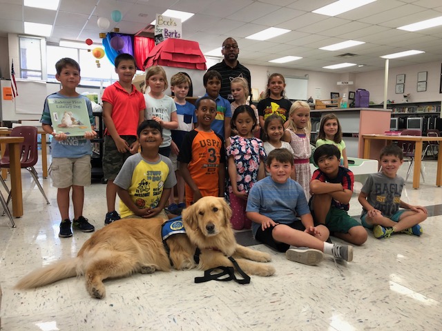 Anderson Elementary book drive winners with Patriot